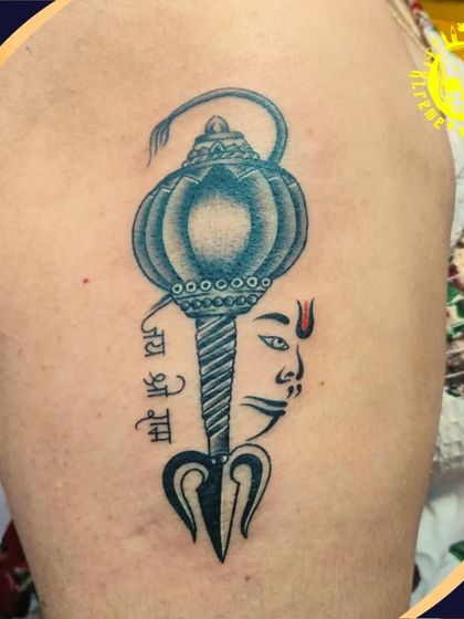 A unique design that merges Lord Hanuman's face with his Gada (mace) and a Trishul. This tattoo is a powerful symbol of strength, devotion, and divine power.