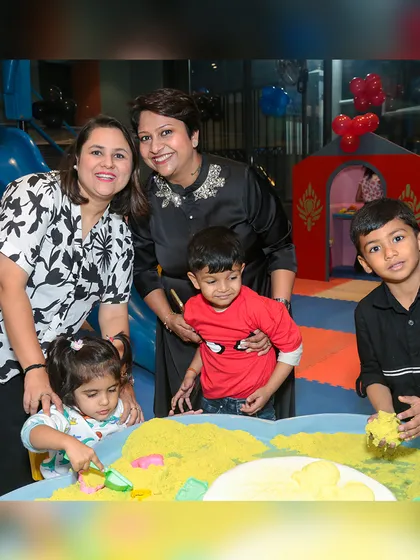 Even the youngest guests have a great time. Here, children are enjoying the sand play area during a break from the superhero action.