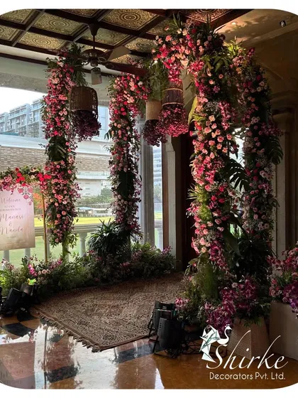 An enchanted garden entrance we crafted to welcome guests. The design features dense arches of pink and white flowers, creating a lush, immersive floral tunnel that sets a magical tone for the celebration right from the start.