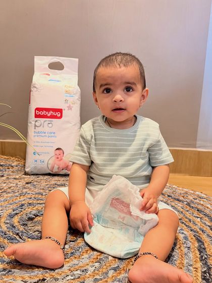 Another image from the Firstcry collaboration, this one shows Gauri holding an open Babyhug Pro diaper. This gives a clear view of the product's interior texture while reinforcing the happy baby imagery.