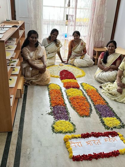 A moment of shared pride as our teachers present the completed Chandrayaan pookalam, a tribute to both culture and science.