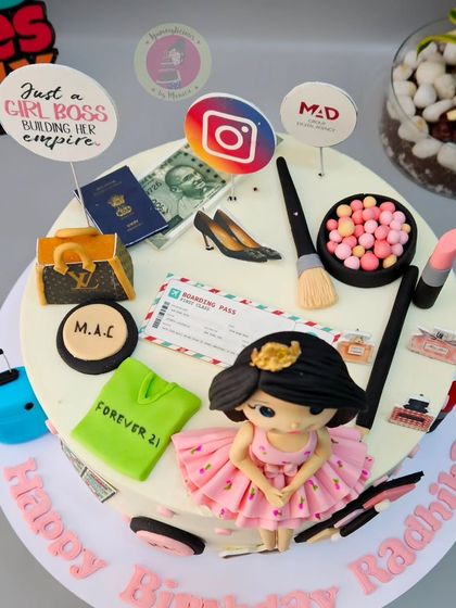 An overhead view of the "Girl Boss" cake, showing all the tiny, personalized details that tell her story.