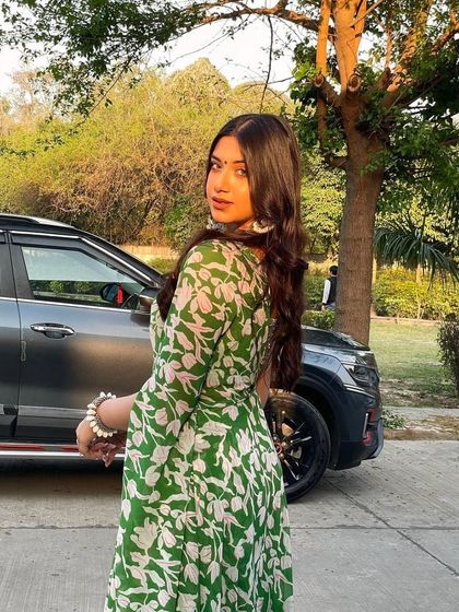 A client looking fresh and beautiful in a green and white printed anarkali. This lightweight and breezy outfit is perfect for a daytime mehendi or a summer wedding.