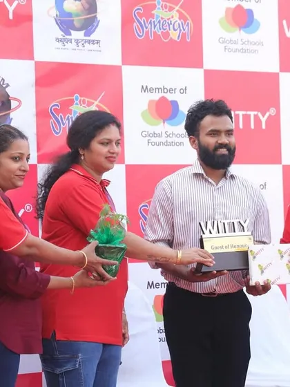 Receiving a token of appreciation at the Witty International School event. It is wonderful to see schools embracing traditional sports and fitness.