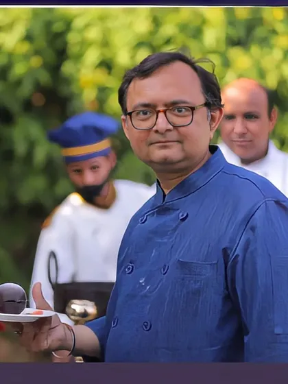 Our chef presenting a beautifully crafted dessert, showcasing the artistry and skill that goes into every dish we serve.