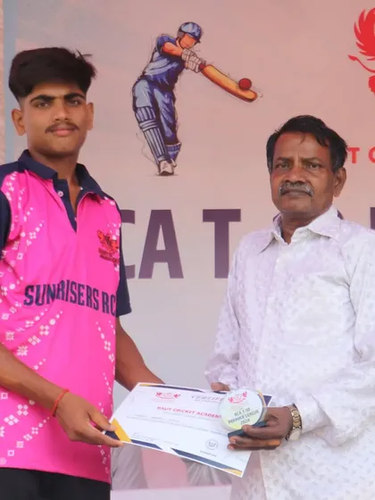 Another member of the Sunrisers RCA team being presented with his participation certificate.