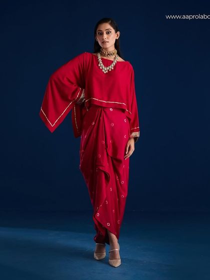 A full-length shot of the Aapro Kimaya Draped Skirt Set, showcasing its unique silhouette.