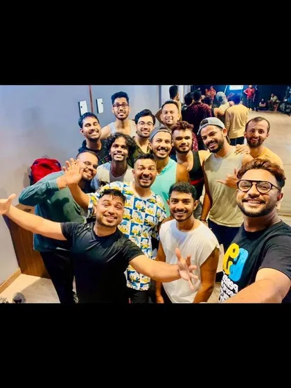 A mirror selfie of a happy group after a weekend fitness workshop. The full-wall mirror is not just for checking form, it's also perfect for capturing those memorable group moments.