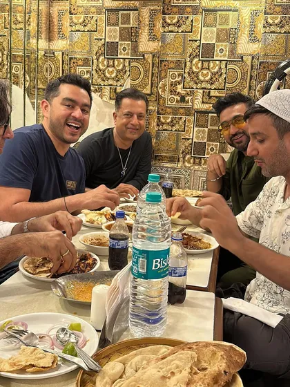 A candid moment of friends and family sharing a meal at our hotel. This is what we love to see, people enjoying good food and good company. This is the real spirit of a daawat.