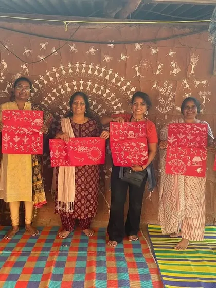 Our students showcasing the Warli art they created during our immersive art retreat. We traveled to an artist's village to learn this beautiful tribal art form in an authentic, inspiring setting.