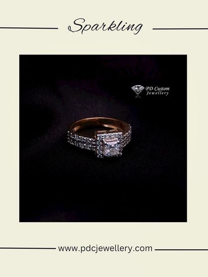 Treat yourself to a beautiful diamond ring. This piece features a princess-cut center stone set in a wide, channel-set diamond band, offering a look of pure luxury.