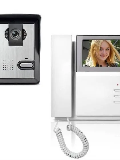 A classic video door phone setup with a handset for clear audio communication. This system includes an outdoor camera unit and an indoor monitor with a physical receiver, which some people find more convenient to use.