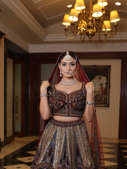 A full-length view of this bride's regal look. The makeup was designed to be elegant and timeless, ensuring her wedding photos will be cherished forever.