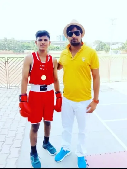 Posing with Jaideep Singh after he won the Interzone School Boxing Championship in 2022. We start training champions from a young age, building a strong foundation for their future in boxing.