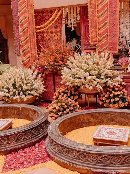 For the Haldi, we created a 'Phulkari Aangan' theme, drawing from the bride's rich Punjabi heritage. The space was filled with vibrant, hand-embroidered fabrics and marigolds.
