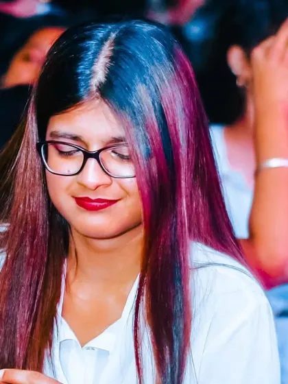 A duplicate of the guest lost in her thoughts, a moment of serene enjoyment.