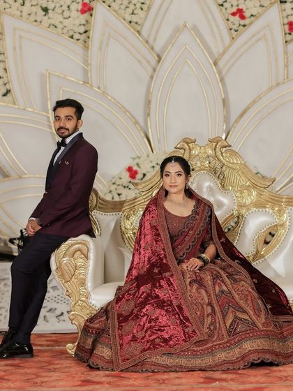 A portrait of the royal couple. The bride's makeup is sophisticated and elegant, fitting for the palace-like wedding venue.