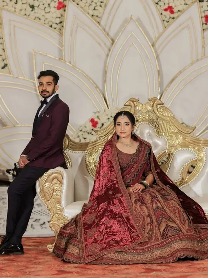 A portrait of the royal couple. The bride's makeup is sophisticated and elegant, fitting for the palace-like wedding venue.