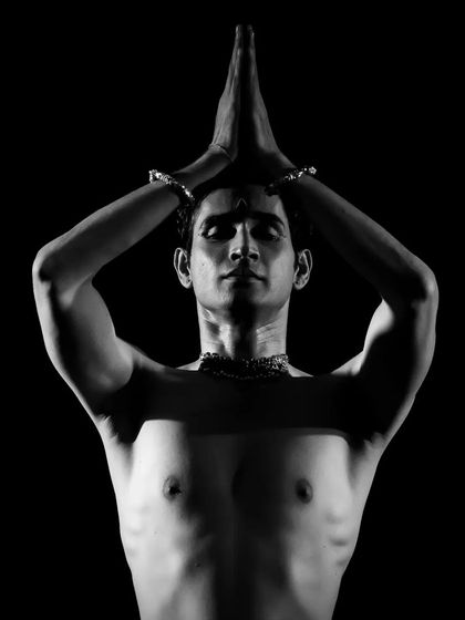 A pose of reverence and focus, captured in stark black and white. This highlights the spiritual devotion that is at the heart of my classical dance practice.