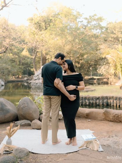 A gentle kiss and a promise for the future. This outdoor portrait captures the peaceful, loving energy between the couple.