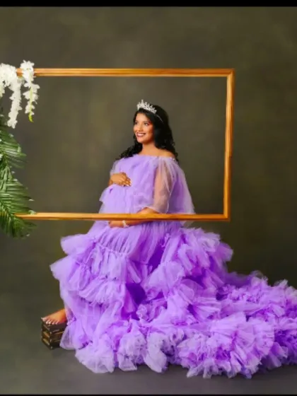 A framed portrait in our lavender gown, complete with a tiara. This setup is perfect for creating a royal and artistic maternity photo.