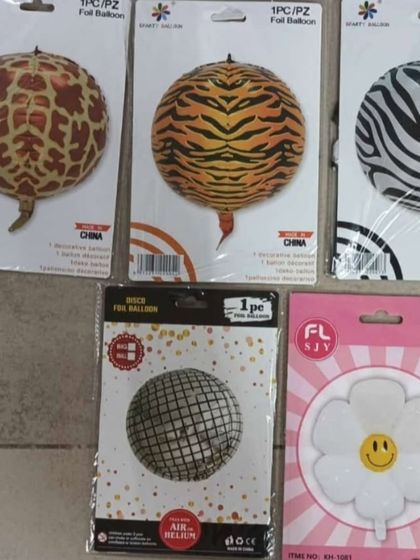I have a variety of foil balloons, including animal prints like giraffe and tiger, disco ball styles, and simple flower shapes to add detail to any theme. ID 29 shows similar items.