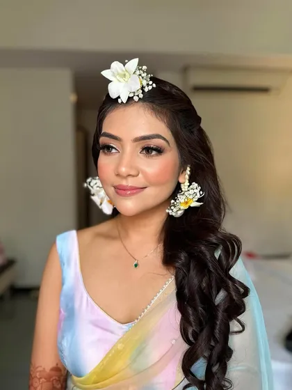 Capturing the perfect dewy, sun-kissed look for a vibrant Haldi ceremony. This makeup is designed to be fresh, light, and waterproof, lasting through all the fun and festivities.