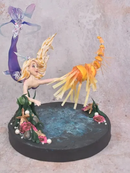 This was my entry for an online modeling competition, and I was thrilled to win second place. My concept was 'Tangled Under Water', reimagining Rapunzel as a mermaid chasing glowing jellyfish instead of lanterns. It was a fun opportunity to push my creative boundaries with dynamic poses and new techniques.