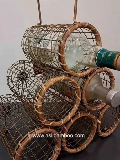 A close-up of our handcrafted rattan and cane wine rack, designed to store six bottles securely. This piece combines rustic charm with functional design, making it a unique and stylish addition to any home bar or kitchen space.