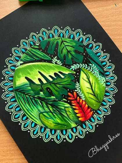 I combined my love for nature and patterns in this tropical leaf mandala. Drawn on black paper, the vibrant greens and blues of the marker art really pop, creating a bold and lively design.