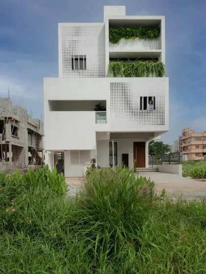 The LUCID House showcases our approach to urban residential architecture on a compact site. A dynamic, perforated metal screen on the facade provides privacy while allowing filtered light to create shifting patterns within the home throughout the day.