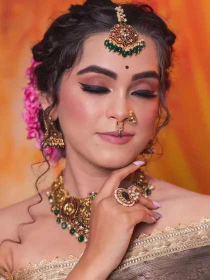 The model's serene expression perfectly complements the elegant jewellery.
