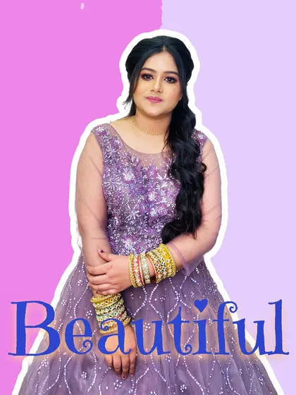 A beautiful client ready for a party or reception in a lavender gown. Her hair is styled in a side-swept braid, and her makeup is soft and pretty, making her look effortlessly beautiful.