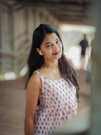 A close-up shot that feels intimate and engaging. The shallow depth of field keeps the focus entirely on her expression.