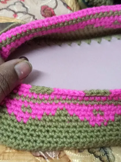 A close-up of the drawstring channel being created for the backpack, ensuring a secure closure.