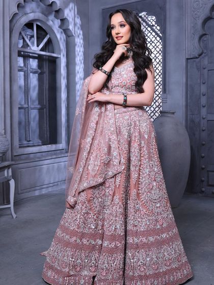 A full-length view that exudes grace and elegance. This is a perfect example of a modern, aspirational bridal look.