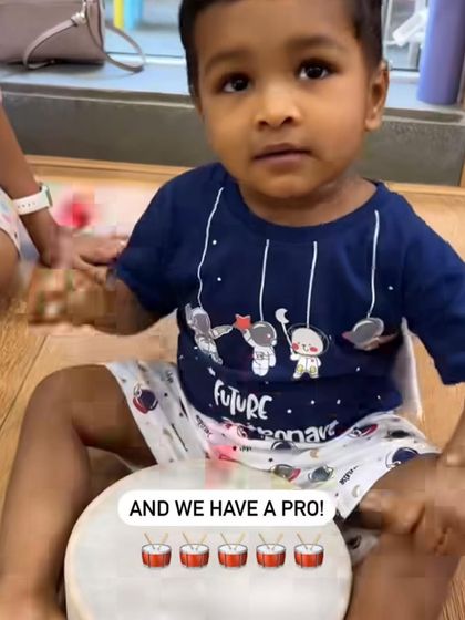 Look at this pro. With a drum and a stick, he is completely in his element, feeling the rhythm. It’s amazing to see how naturally children take to making music.