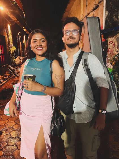 Post-gig photo with my talented guitarist. Teamwork makes the dream work.