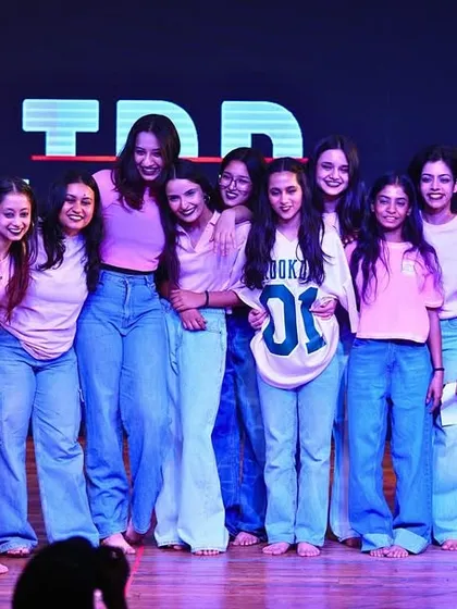 This is what we mean by family. A candid moment with our extraordinary humans on stage after a performance. We rehearse together, grow together, and celebrate together. This is our tribe.