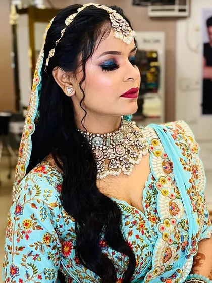 A side profile highlighting the beautiful blend of the eyeshadow and the flawless skin finish.