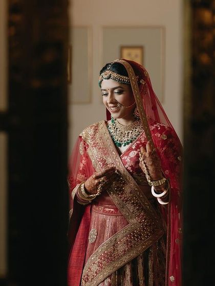 A quiet moment captured as bride Tanya gets ready. The soft lighting and her calm expression create a beautiful and intimate portrait before the ceremony begins.