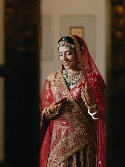 A quiet moment captured as bride Tanya gets ready. The soft lighting and her calm expression create a beautiful and intimate portrait before the ceremony begins.