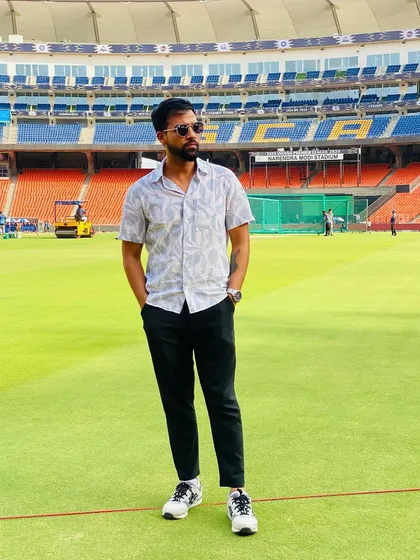 A moment of calm on the field at the Narendra Modi Stadium, one of the world's most iconic cricket grounds. The atmosphere is always electric.