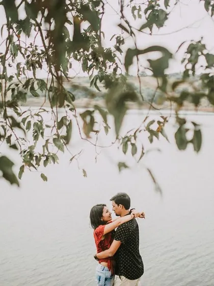 An embrace by the water's edge. This photo captures a simple, loving hug, showing that sometimes the most powerful shots are the quietest ones.