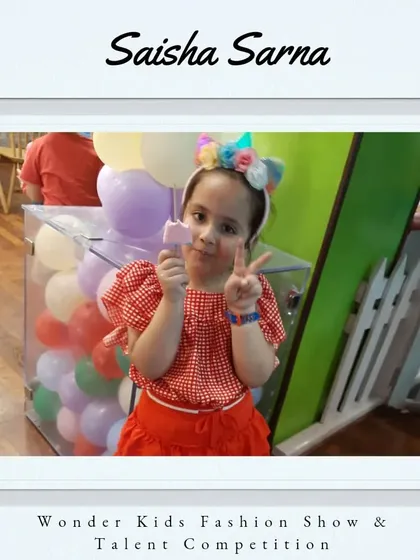 A warm welcome to Saisha Sarna. Her playful pose and festive headband are full of joy.