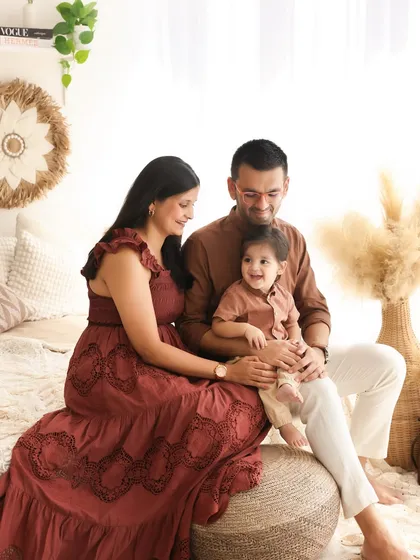 Cozy, candid, and full of love. This shot captures a quiet, intimate moment between a family in our comfortable studio. The warm, earthy tones of the setup enhance the feeling of togetherness.