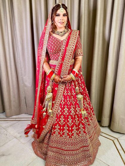 Another full-length view, showcasing the beautiful fall of her embroidered lehenga.