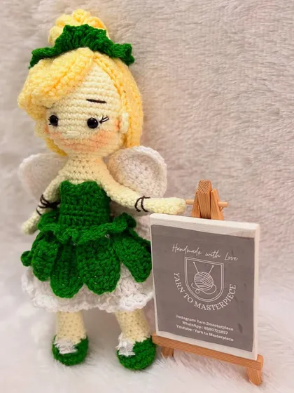 Bringing fairy tales to life, one stitch at a time. Here is my version of the beloved fairy Tinkerbell, a 10-inch amigurumi doll complete with her signature green dress, wings, and hairstyle, crafted from soft cotton yarn.