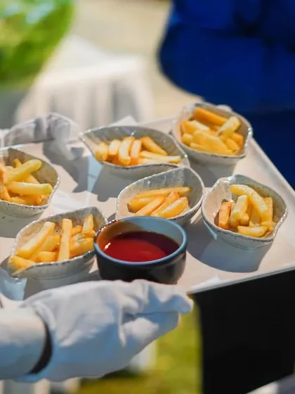 Simple, classic, and always a hit. We serve perfectly crispy French fries in individual paper cones with ketchup, a snack that is loved by guests of all ages at any party.