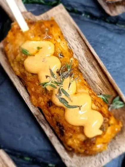 A crispy polenta stick with a creamy sauce. We love creating unique vegetarian canapés that are packed with flavour and texture.